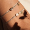 Bracelets cordons gris lurex Bestouan duo pierre de lune blanche pierre de lune grise pierre naturelle or jaune 18 carats recyclé mineral joaillerie éthique bijoux mixtes